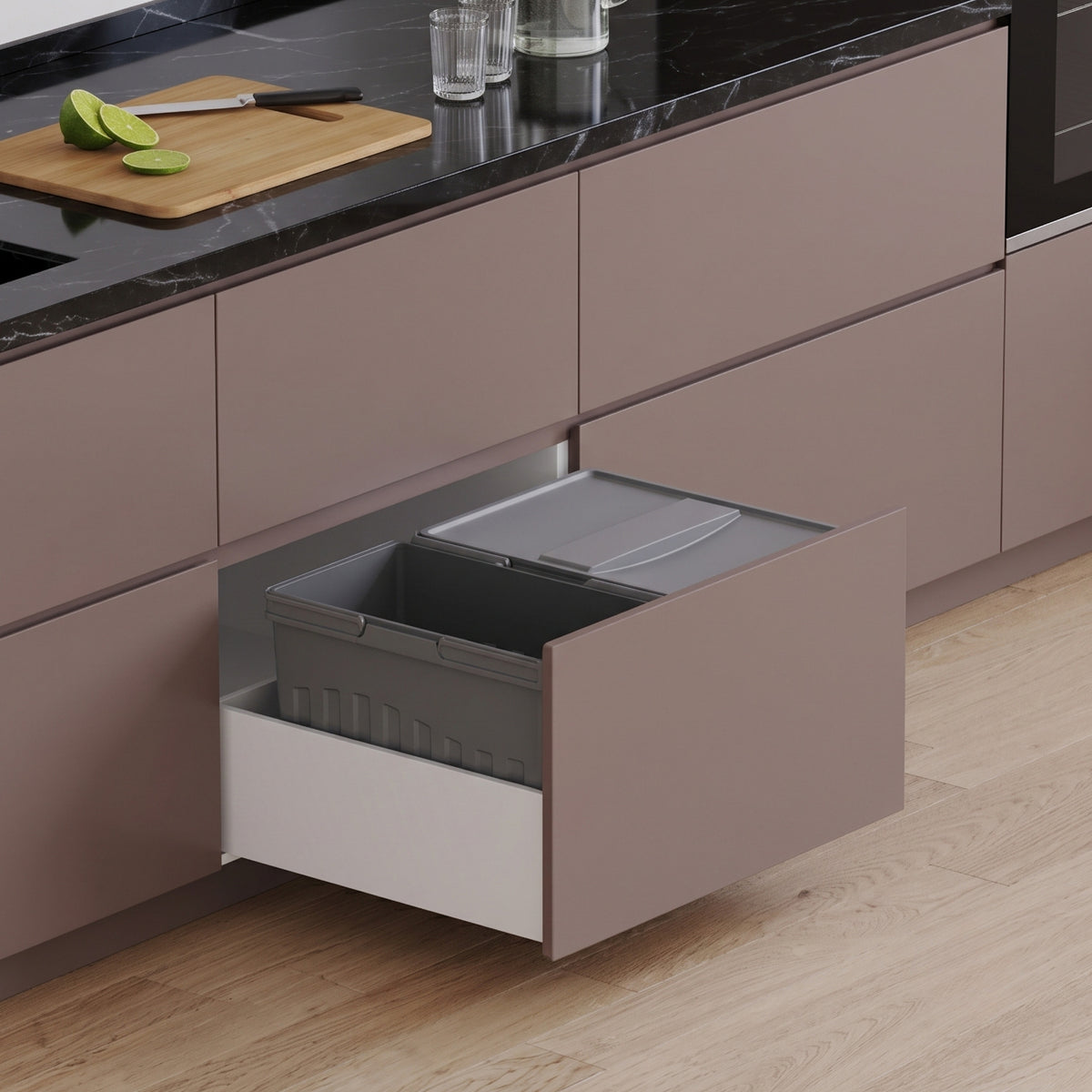 Ebco Livsmart 35L pull-out kitchen drawer bin with two compartments, shown installed inside a modern modular kitchen cabinet drawer.