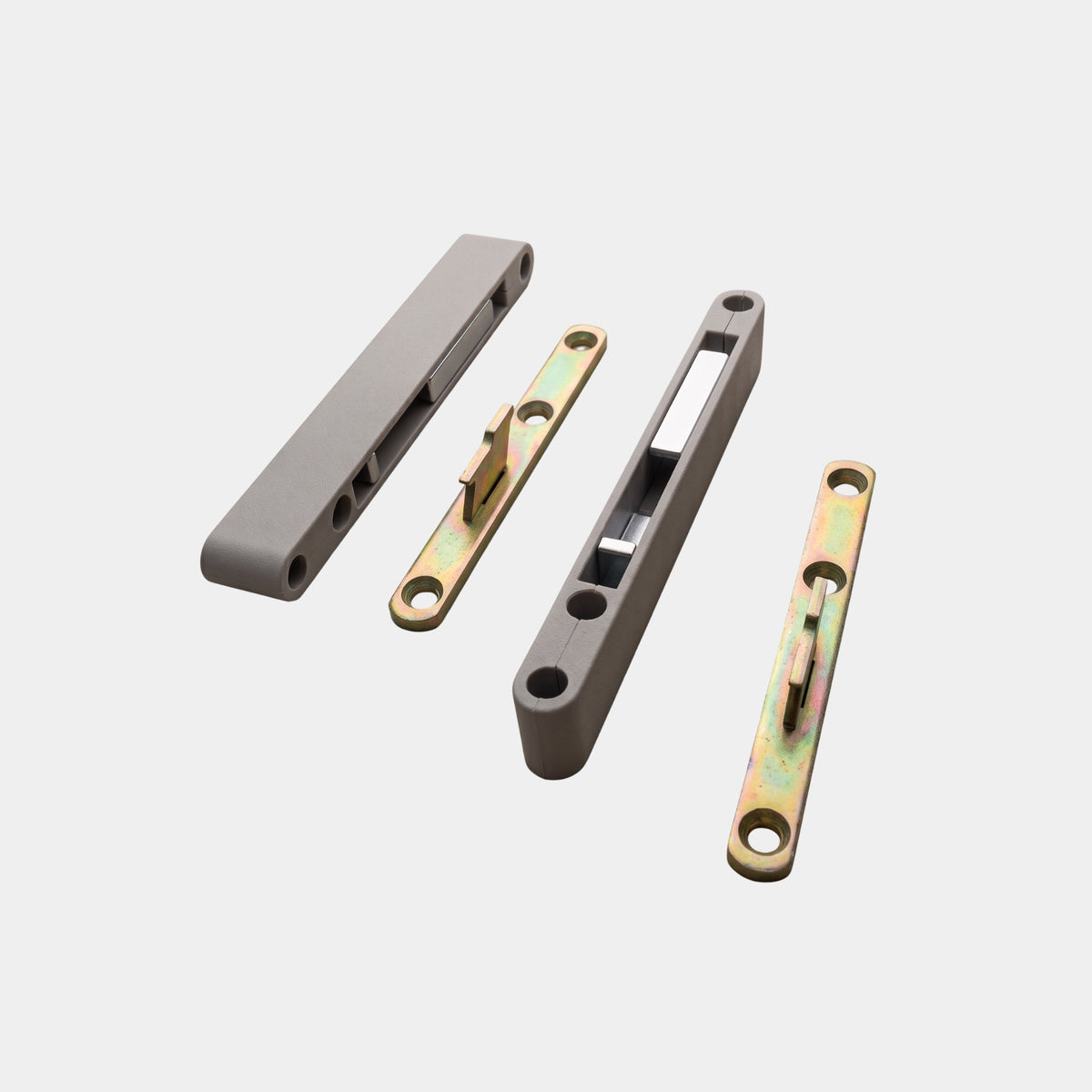 Close-up of Ebco CHC1 concealed cabinet hanger components, displaying the grey housing units and golden mounting plates.