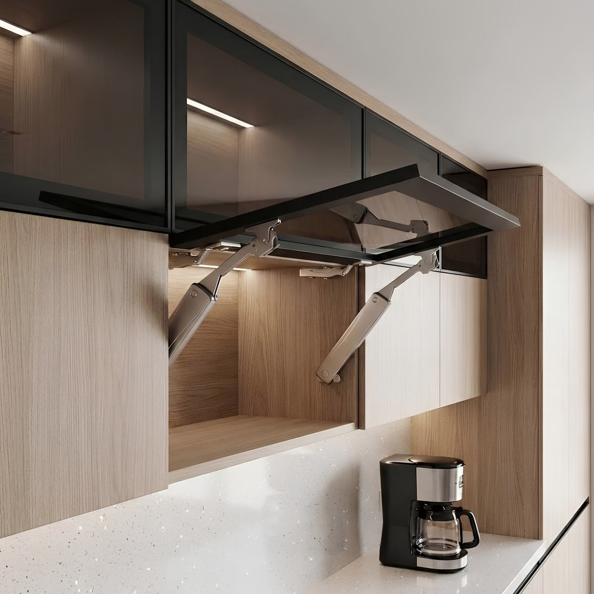 Ebco Livsmart Heavy Shutter Lift mechanism supporting a black framed glass overhead cabinet door in a modern modular kitchen, available at Hardware Depot.