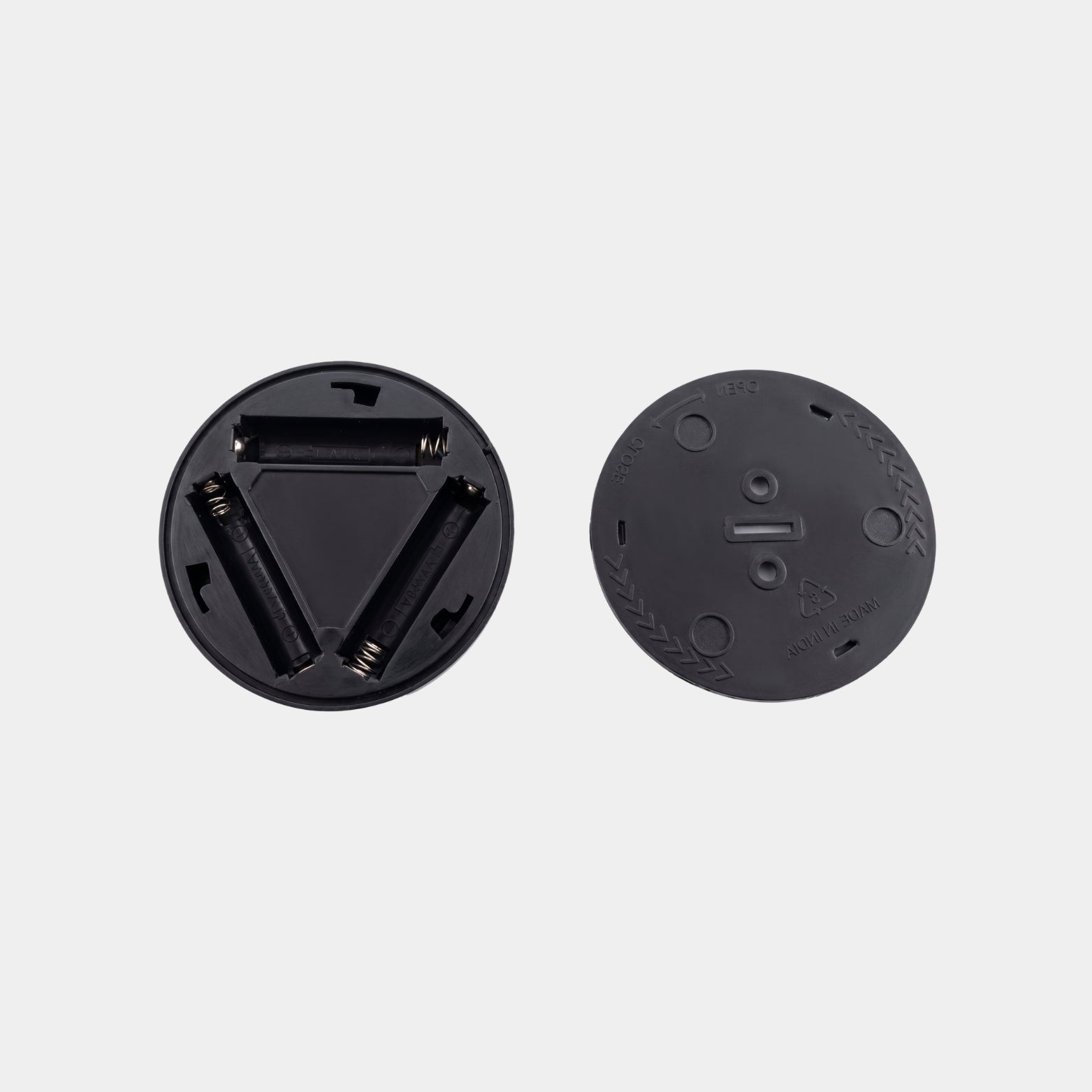 Inside view of Ebco wireless motion sensor light showing the 3 AAA battery slots and rear cover panel