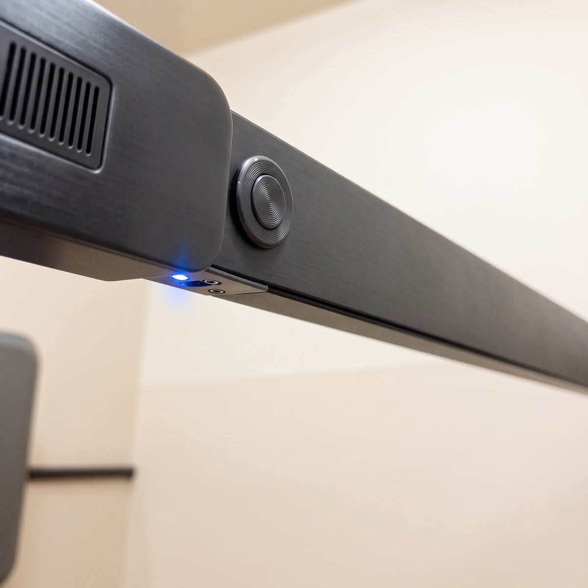 Close-up detail of the anthracite crossbar and blue LED indicator light on the Ebco Livsmart electric wardrobe lift, available at Hardware Depot.