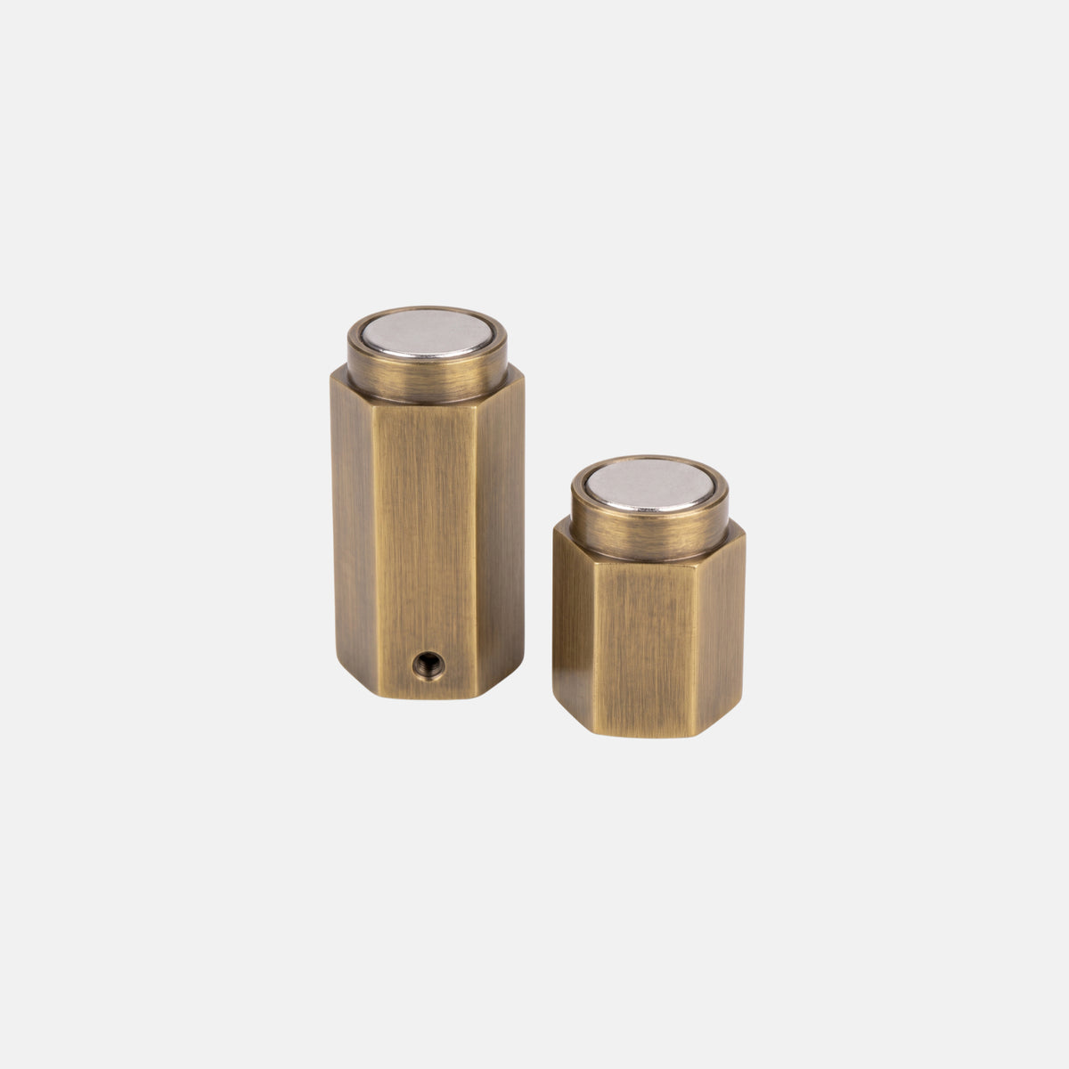 Faceted hex solid brass magnetic door stopper pair showing neodymium magnet joint faces Hardware Depot SS Hardware