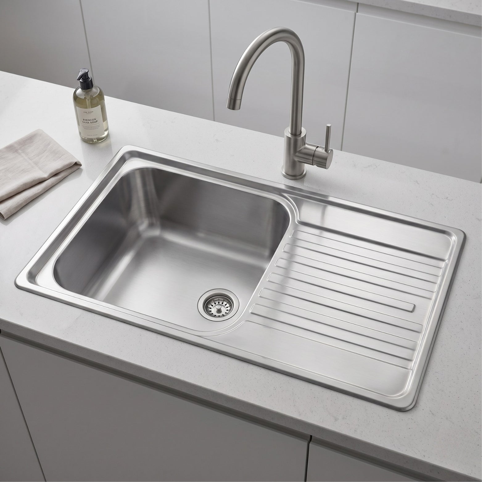 Franke Maris RSX611-91 kitchen sink in brushed satin finish installed on quartz countertop with a premium goose neck deck-mounted faucet tap.
