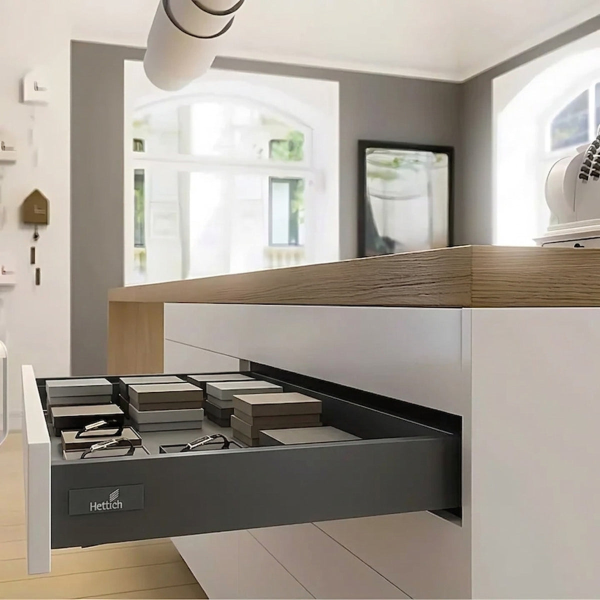 Hettich InnoTech Atira tandem box in Anthracite finish, showcasing a sleek, open drawer system in a modern kitchen island
