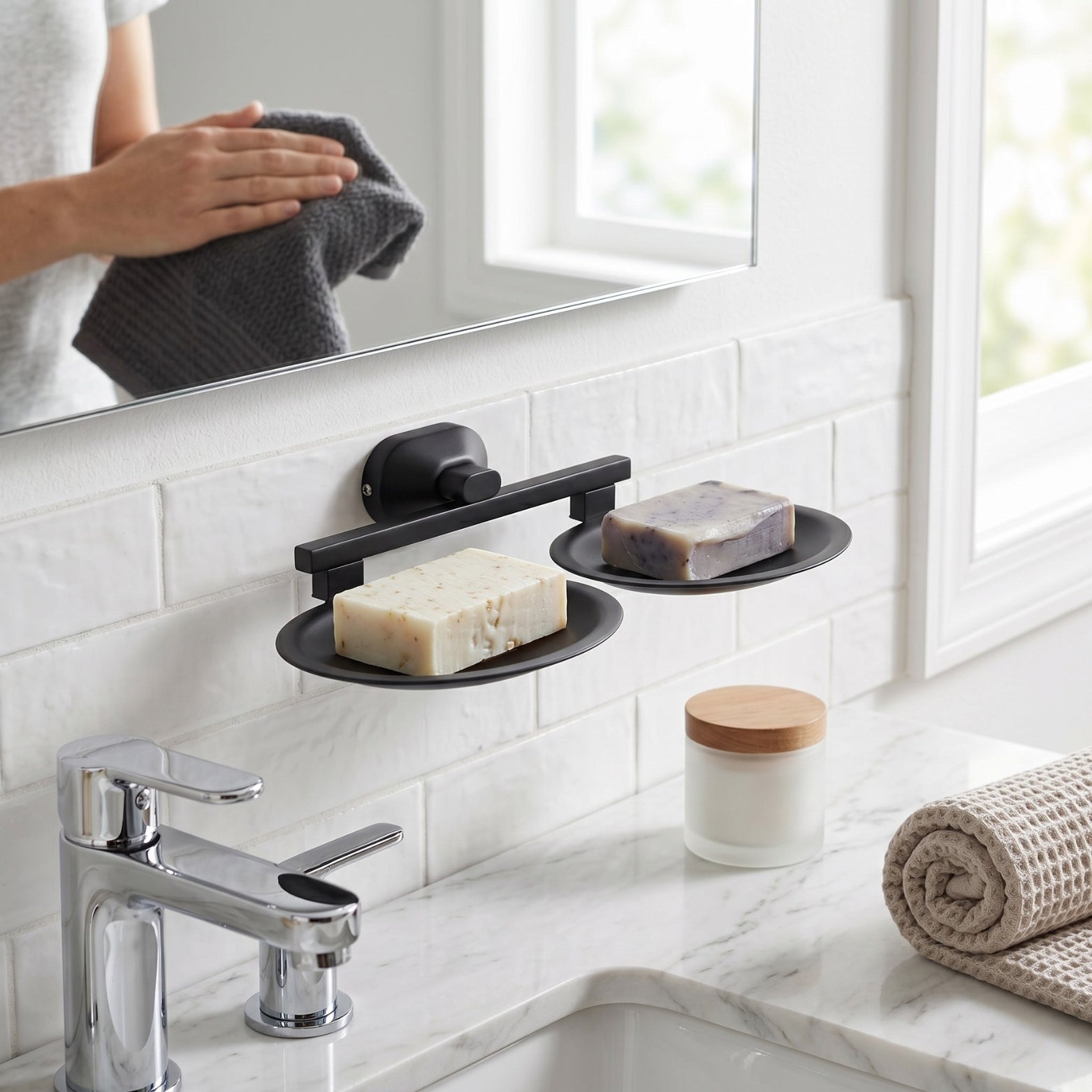 Sparrow matte black dual soap holder mounted on a white tiled bathroom wall above a marble sink countertop