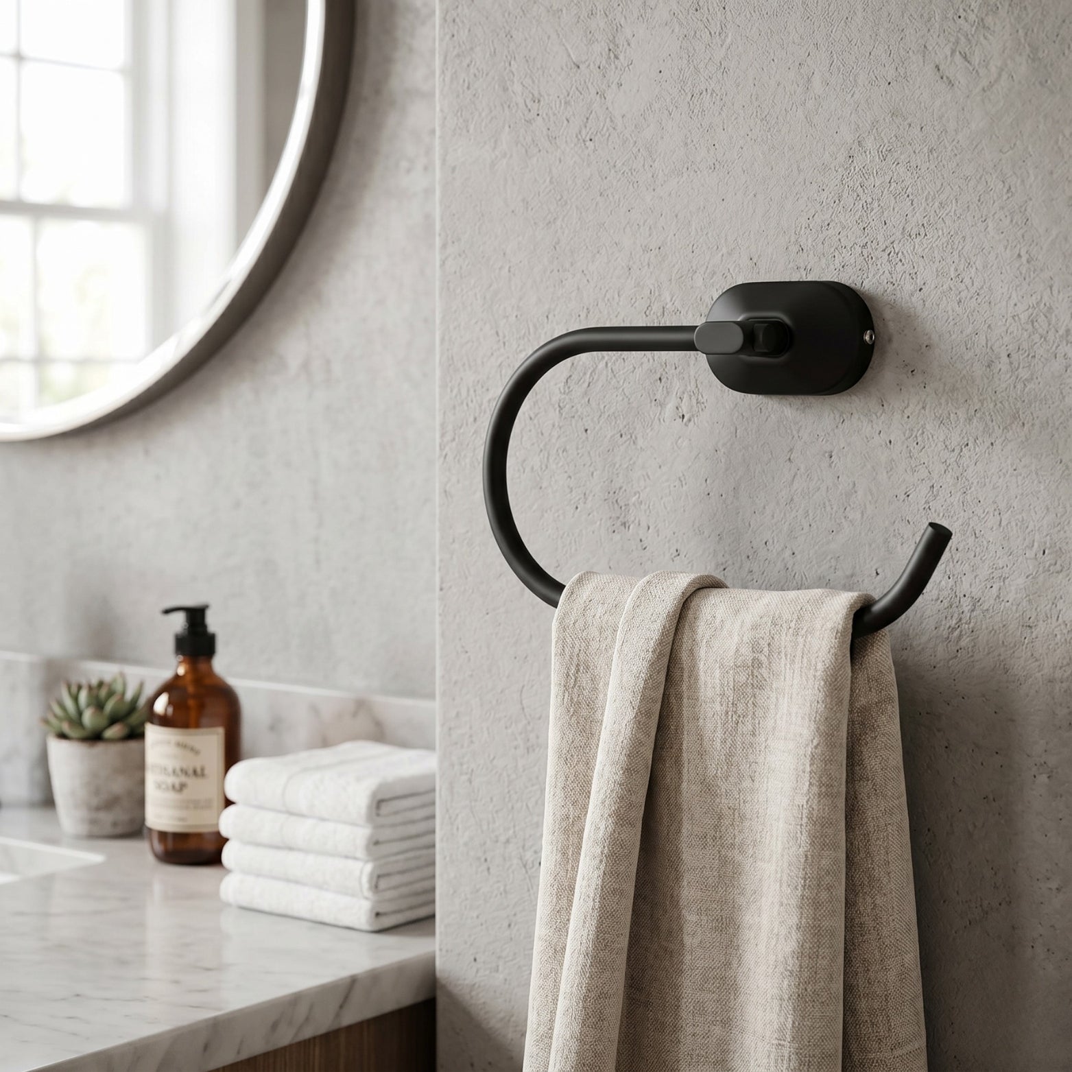Sparrow SS304 premium towel ring in matt black finish mounted on a modern concrete bathroom wall by Hardware Depot Bangalore