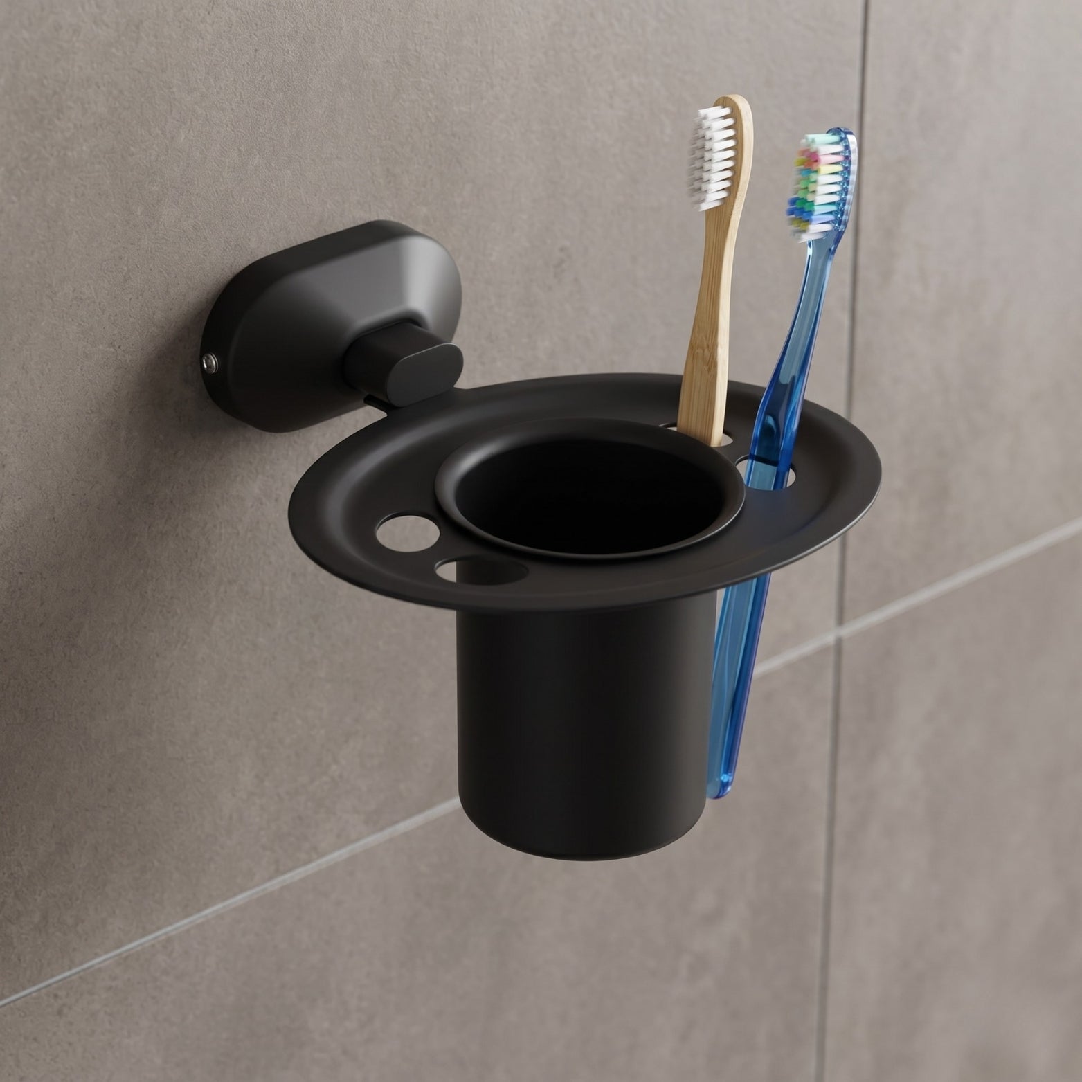 Sparrow SS304 stainless steel tumbler and toothbrush holder in matt black finish mounted on a grey tiled bathroom wall, holding toothbrushes, available at Hardware Depot Bangalore
