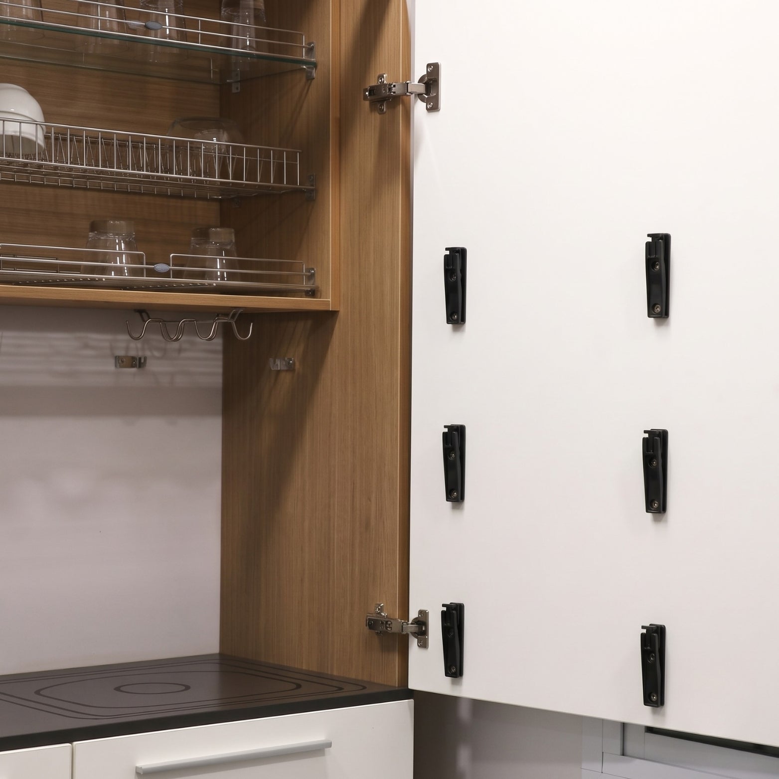System 32 door-mounting clip brackets installed on cabinet shutter, available at SS Hardware Bangalore